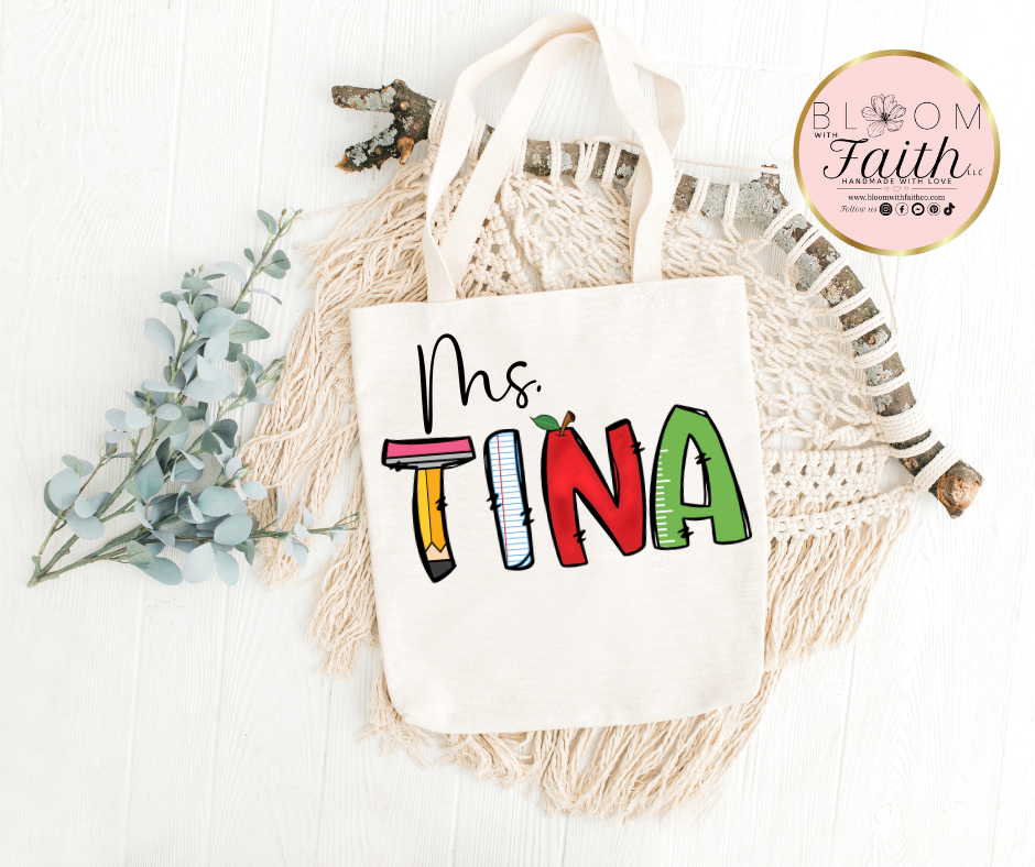 Personalized tote bag with teacher's name with school-themed letters.